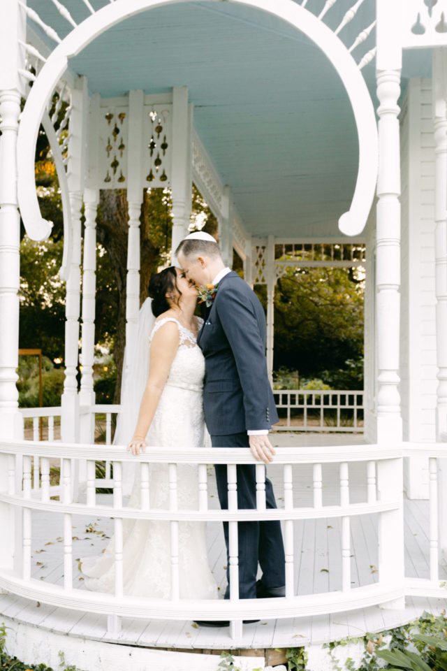Julke and chris share a kiss on the front porch of the barr mansion