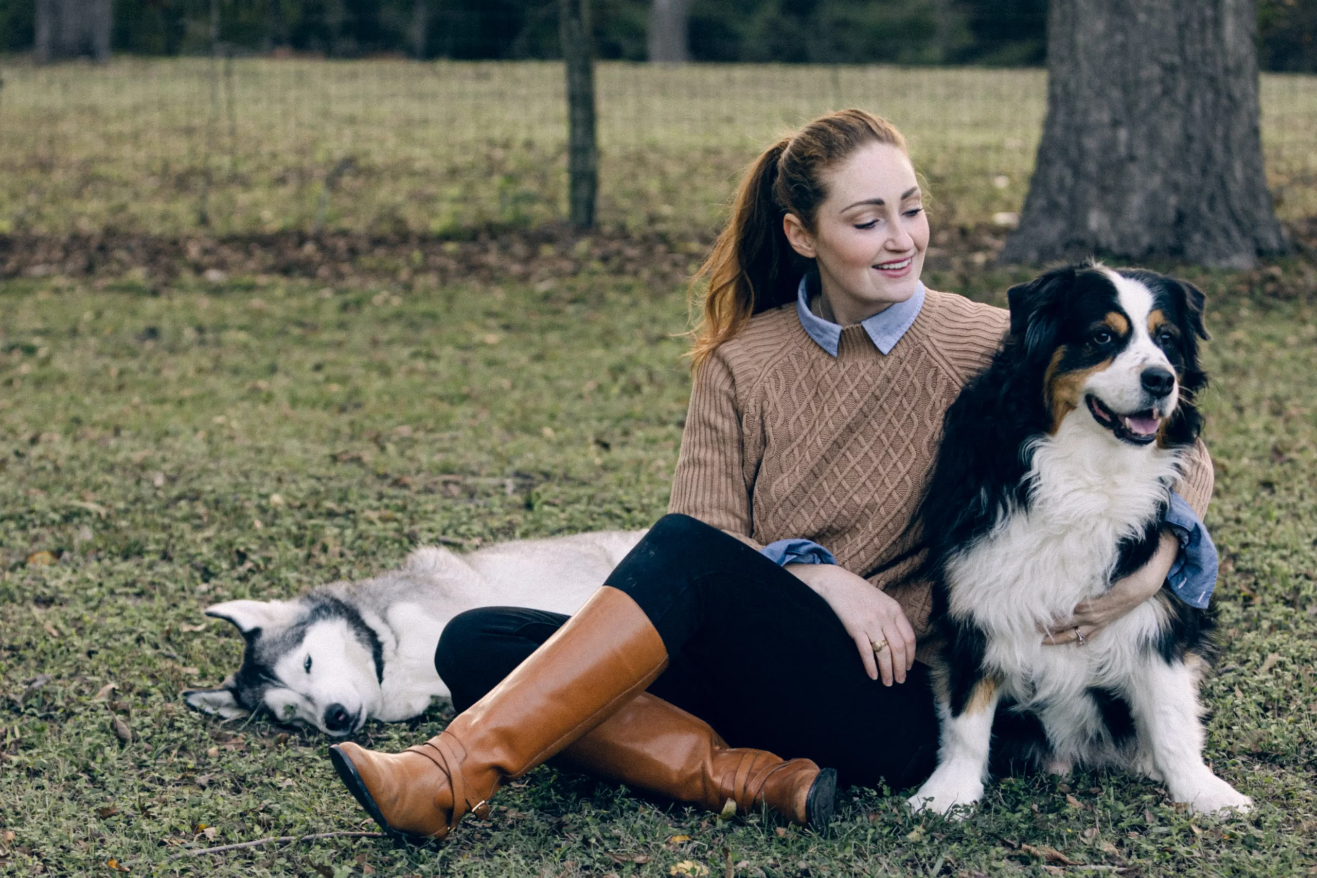 Color image of Samantha the owner of Rae Allen photography with her two dogs