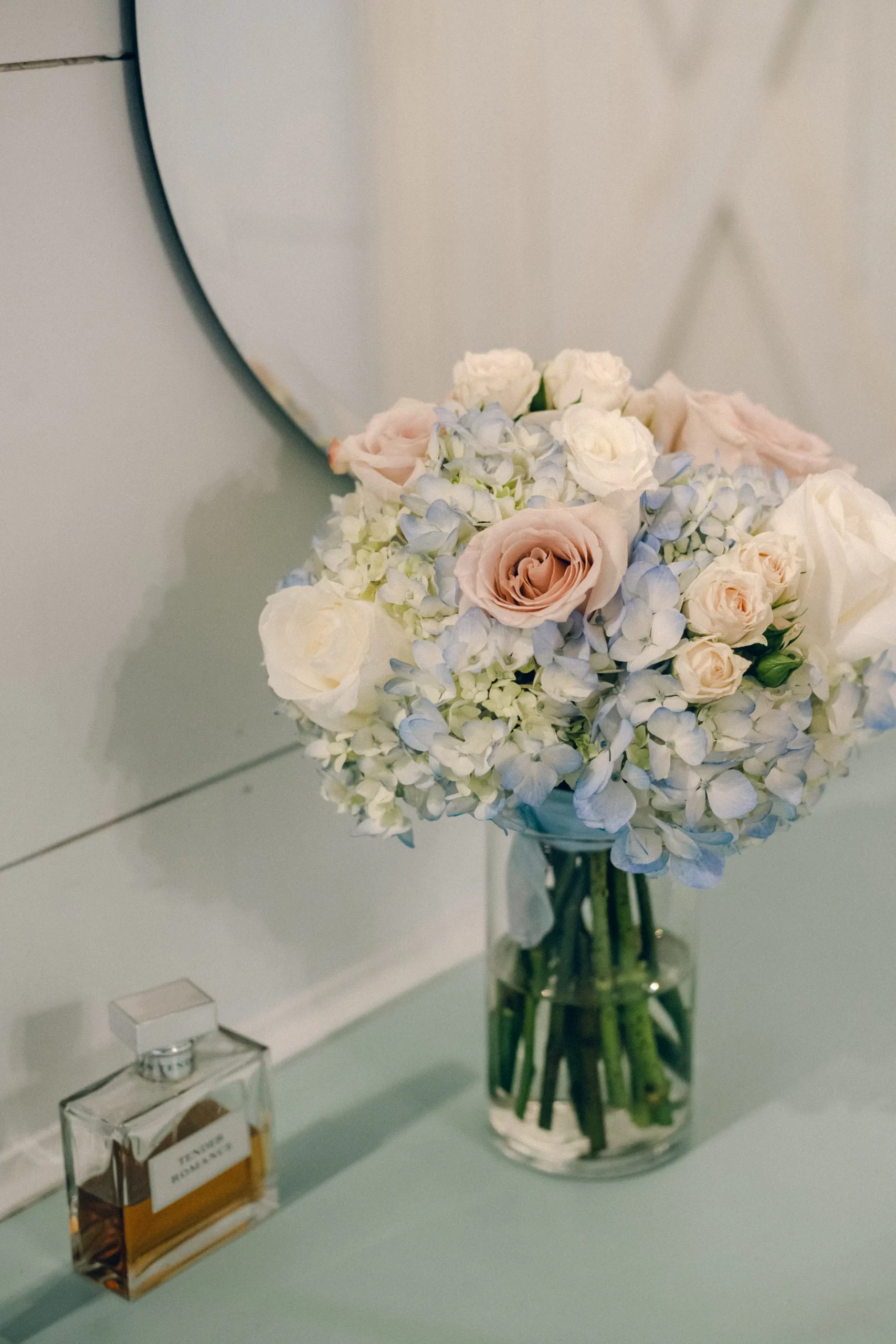 a detail image of the bride's bouquet full of hydrangeas and roses
